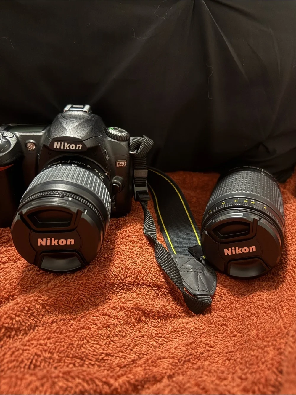 Nikon DSLR Camera Kit with Black Lowepro Bag and Yellow-Accented Strap